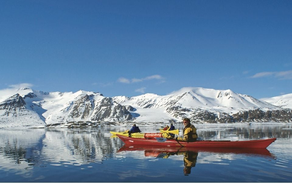 Kayaking the pristine, glass waters of the Arctic is an adventure travel experience like no other.