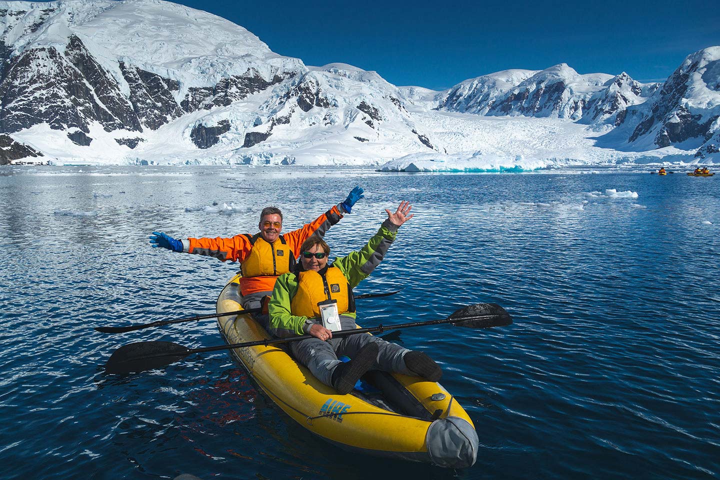 Quark Expeditions guests participate in the Sea Kayaking program during an Antarctic voyage.