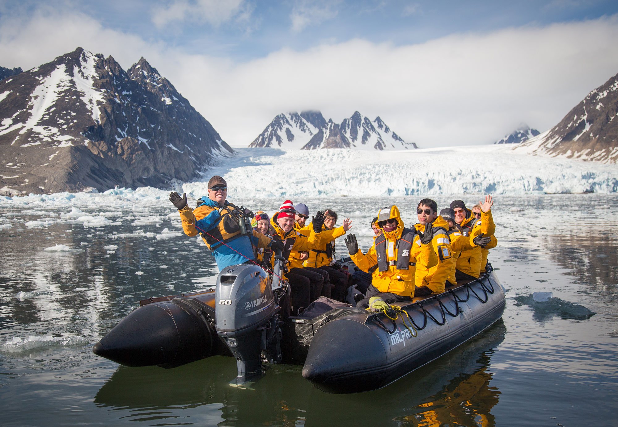 Quark Expeditions guests get close-up views of the expansive Monacobreen Glacier during a Zodiac excursion.