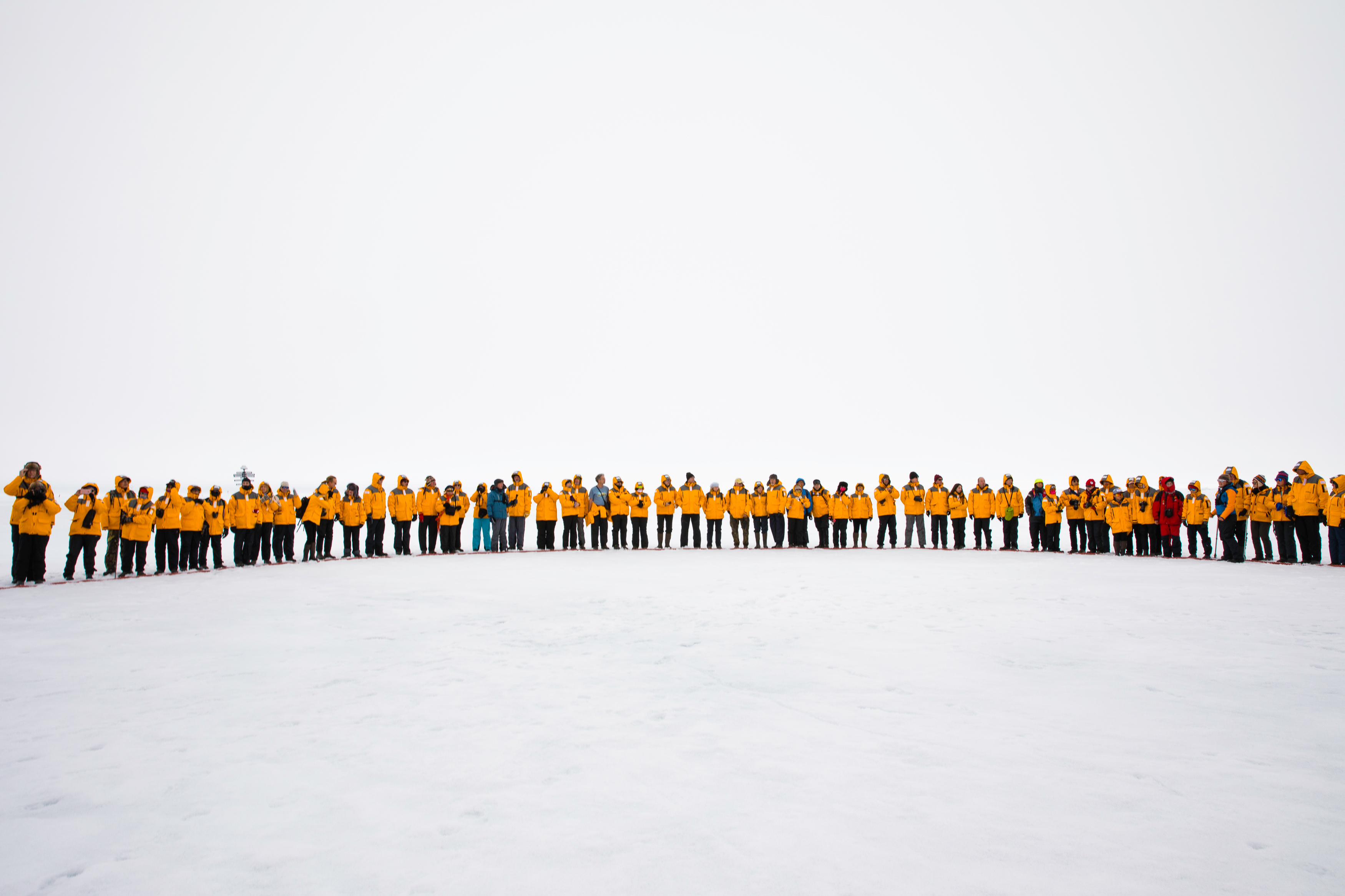 North Pole passengers standing together for the Circle Ceremony near the North Pole. Photo: Dani Plumb