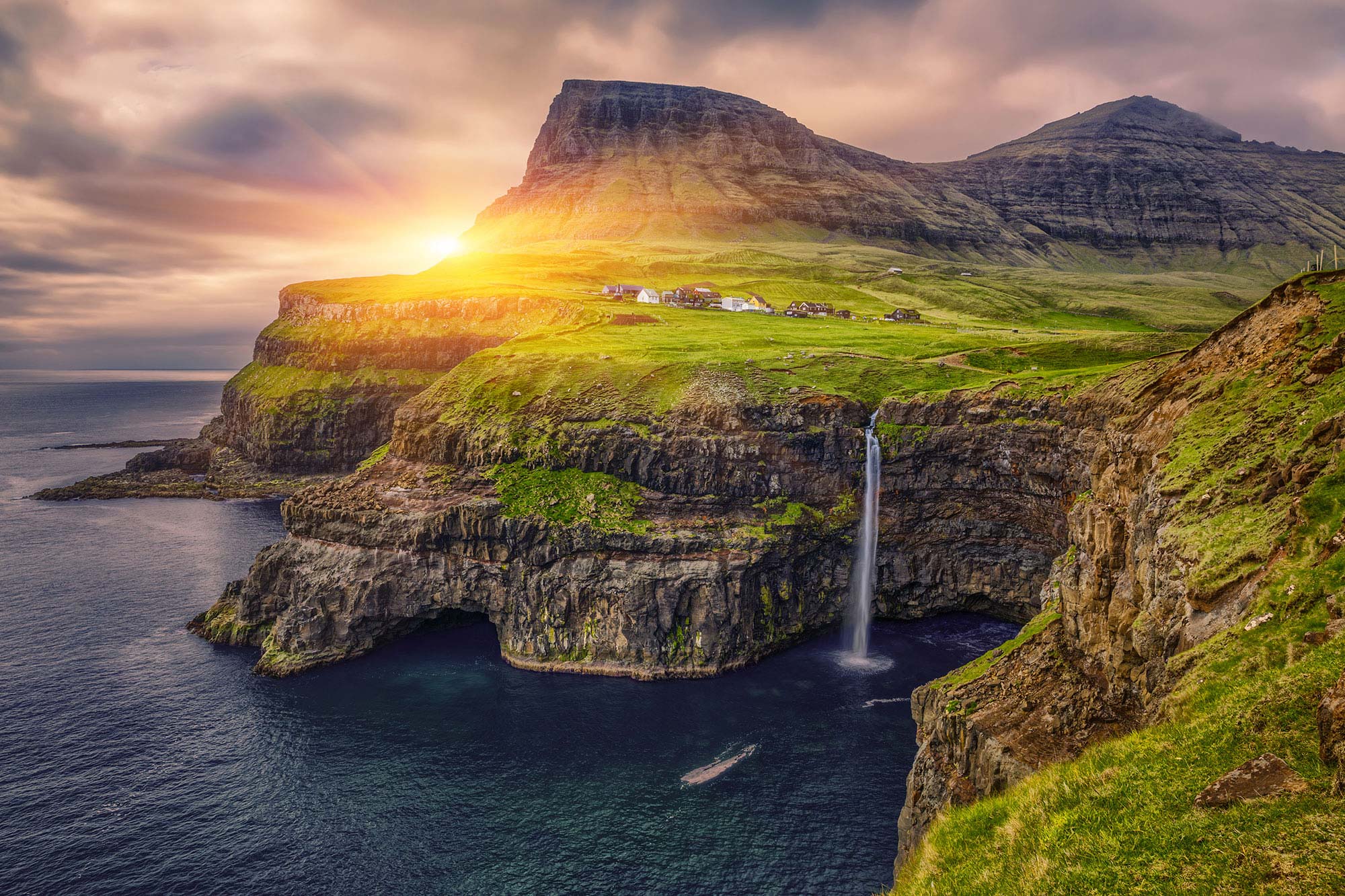 Grassy mountain and cliffs of the Faroe Islands.