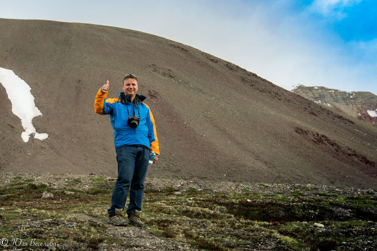 Hans Lagerweij gives the view from high atop the Arctic tundra in Svalbard a thumbs up on his recent expedition with Quark.