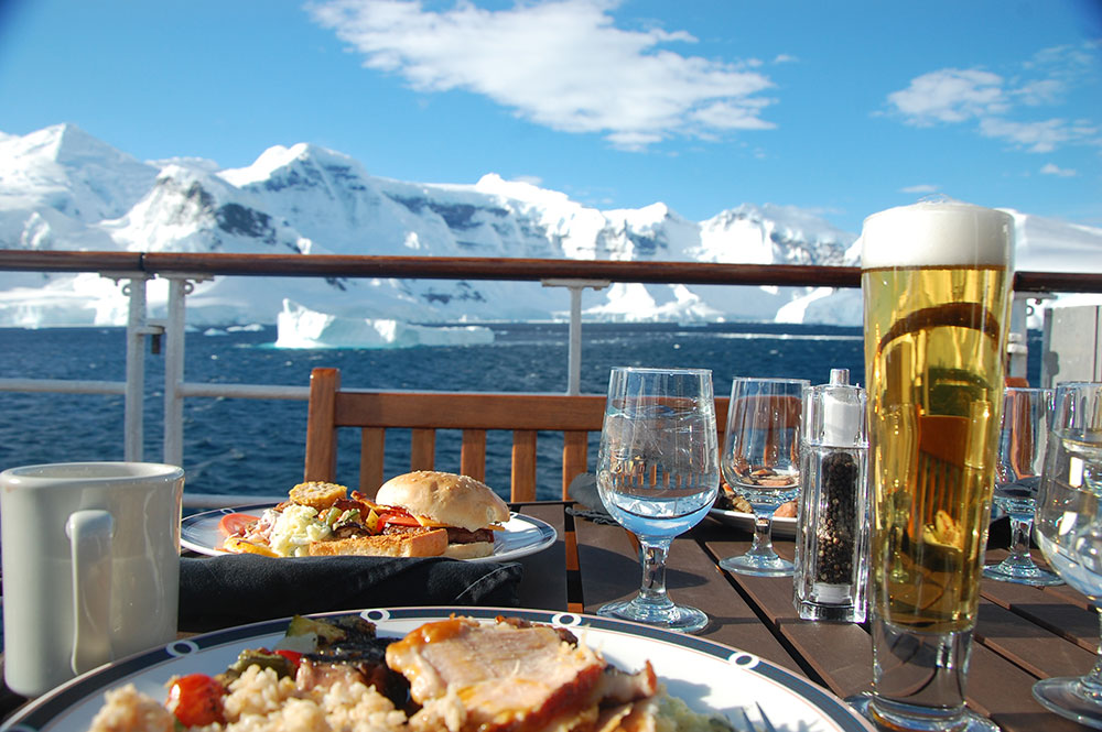 Passengers dine on deck in Antarctica when the weather permits.