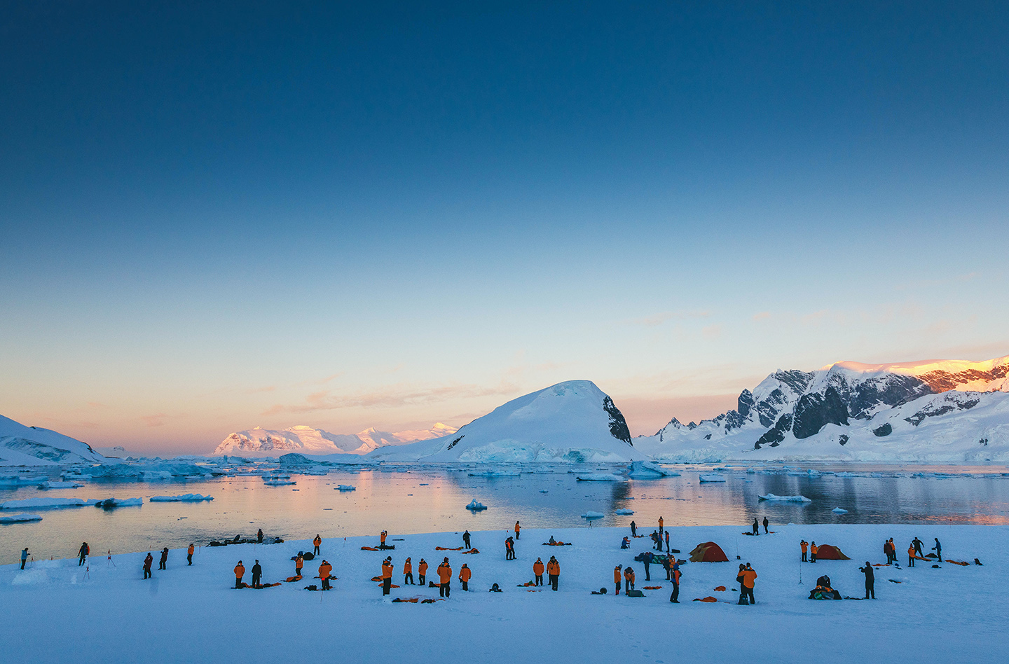 Quark Expeditions guests prepare for overnight camping in Antarctica. 