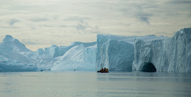 Guests explore the ice-laden water ways of the Canadian High Arctic on Zodiacs.