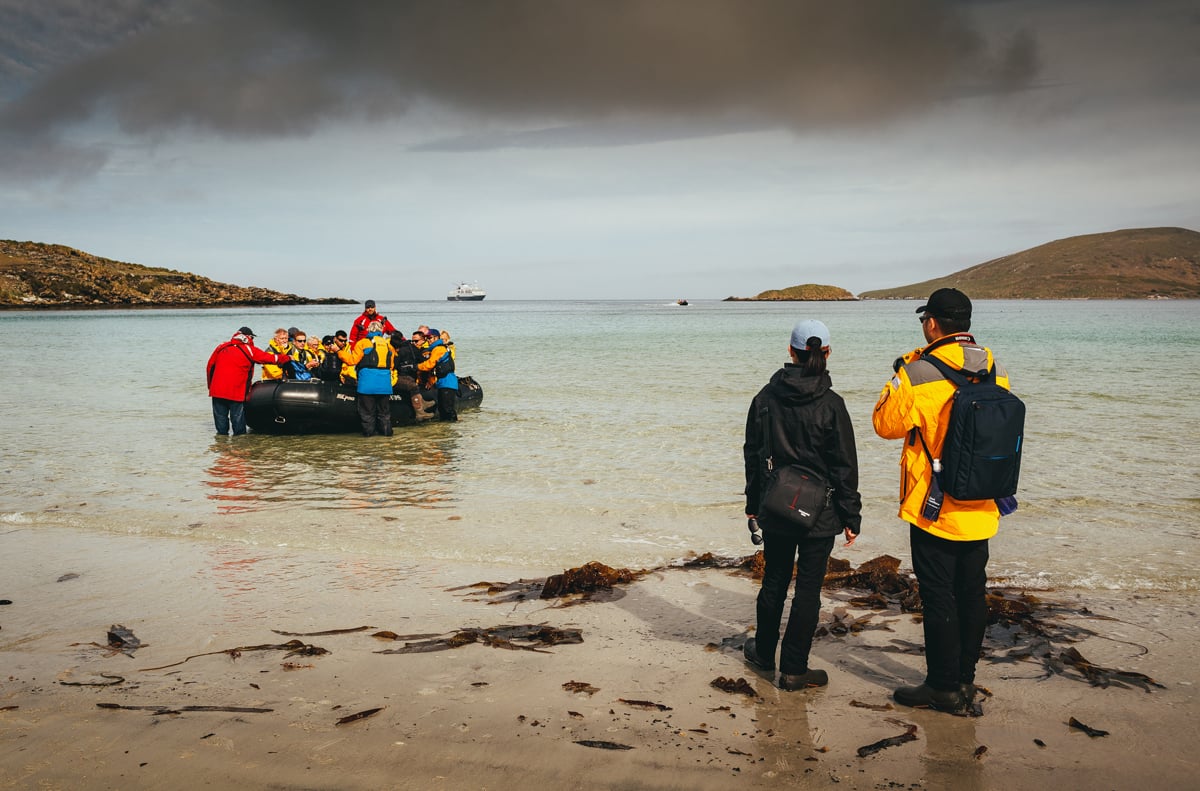 Passengers getting out of a zodiac at Saunders Island