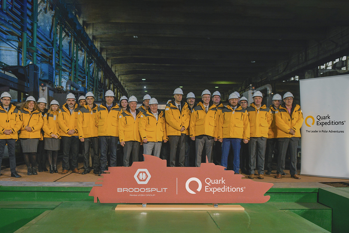 Quark Expeditions and Brodosplit team pose for a group photo at the Steel-Cutting Ceremony at the Shipyard. 