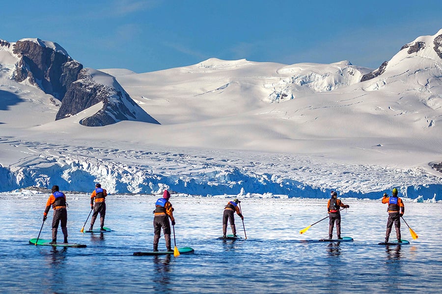Stand-up Paddle Boarding in the Antarctic Peninsula. Photo: Abbey Weisbrot