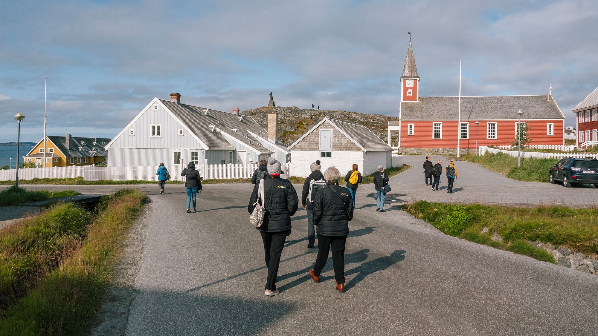 Quark Expeditions guests explore Nuuk on a walking tour. Nuuk is the cultural and administrative hub of Greenland. 