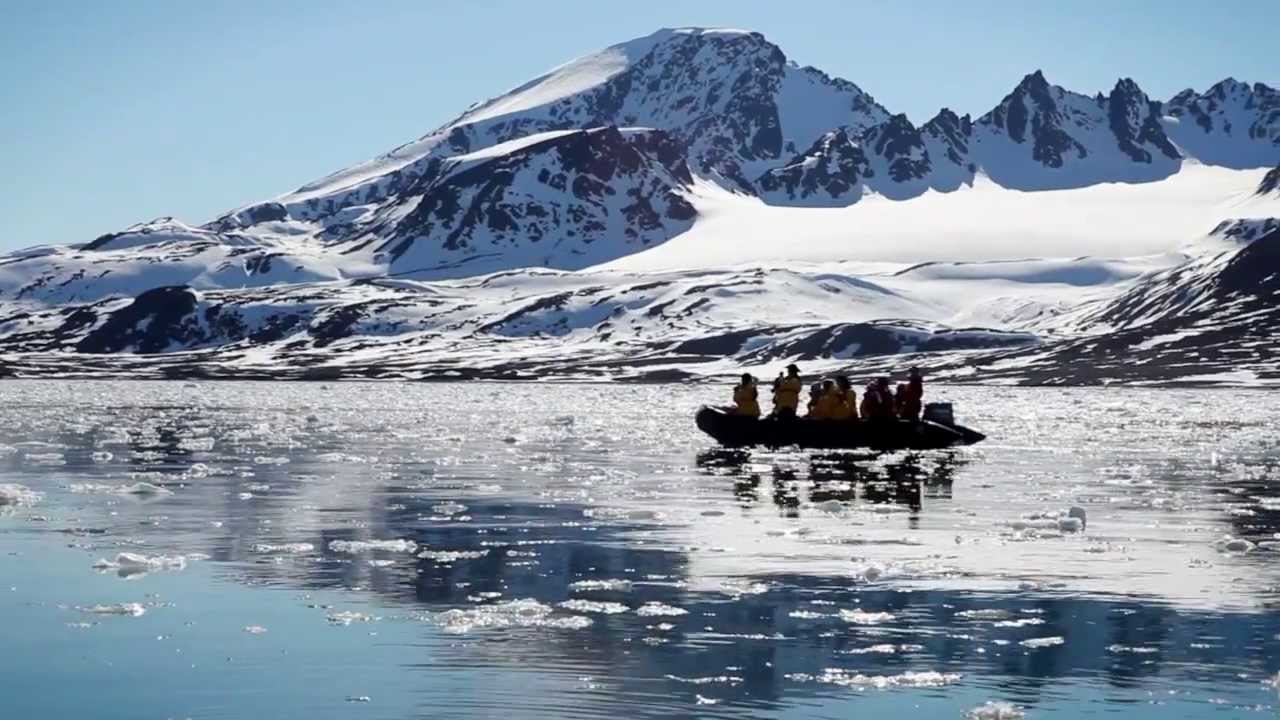 Spitsbergen Explorer passengers traverse an icy inlet by Zodiac, on the lookout for polar bears, hauled out walrus and other wildlife.