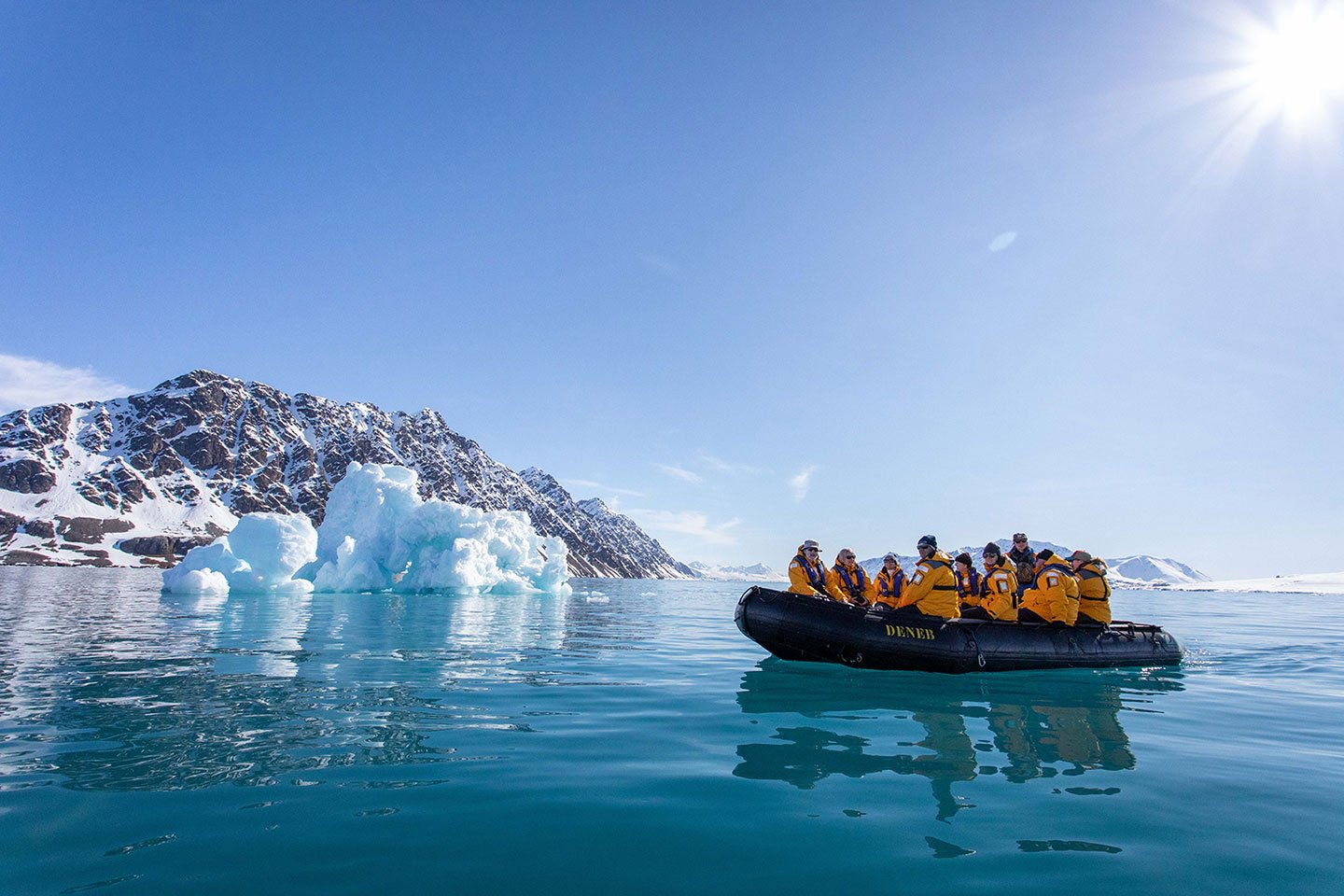 Guests enjoy a Zodiac tour during a polar expedition in Svalbard.