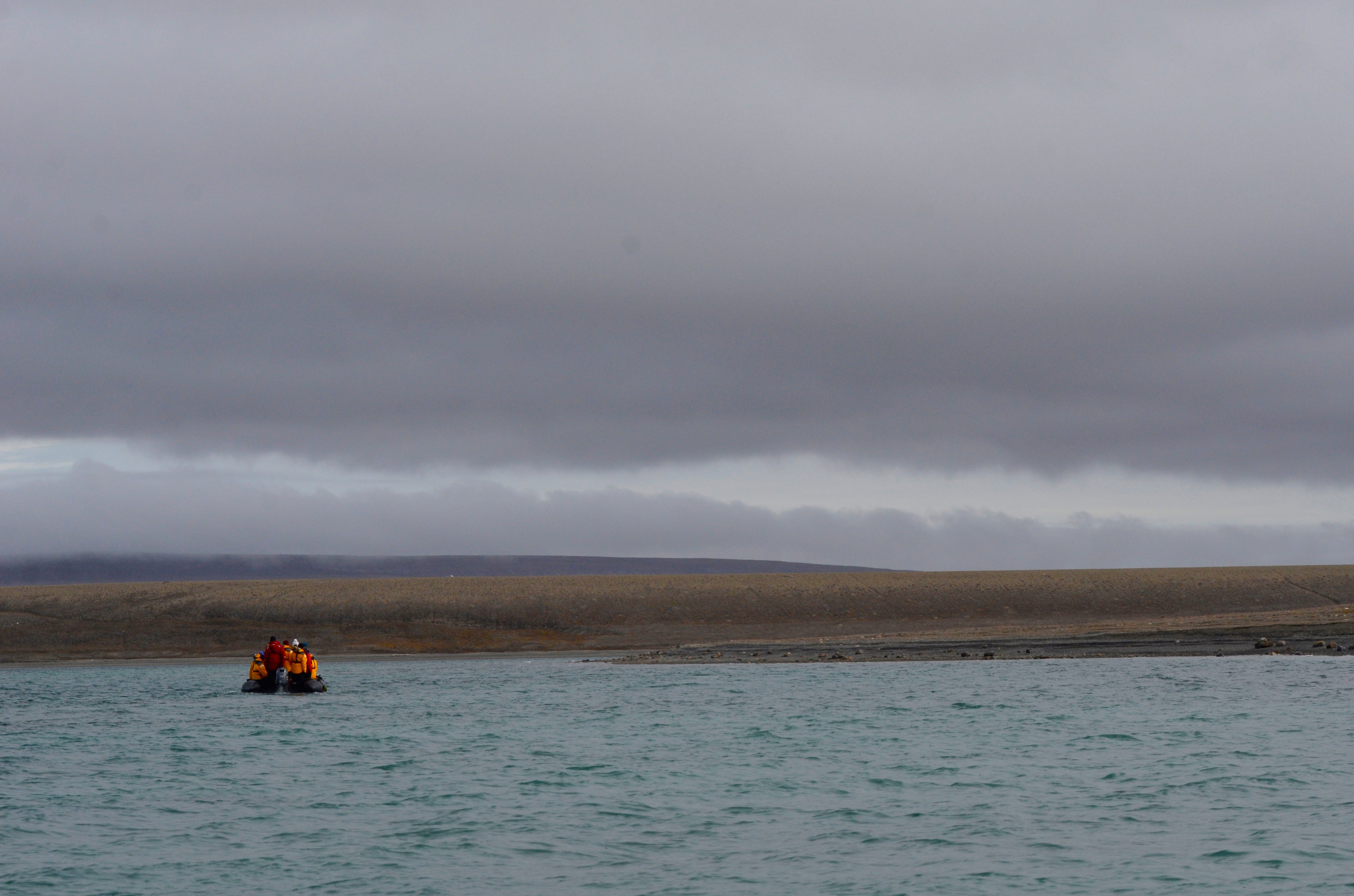 Quark passengers cruise in Zodiacs between the Boothia Peninsula and Somerset Island in the Arctic.