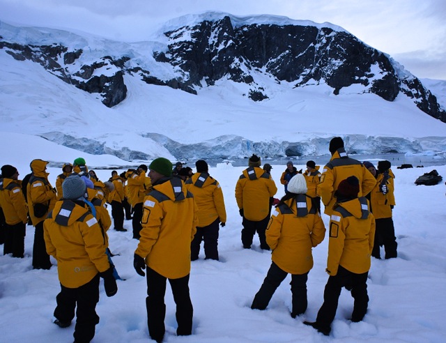 A group of adventurous Quark passengers at their Antarctic camping safety briefing.