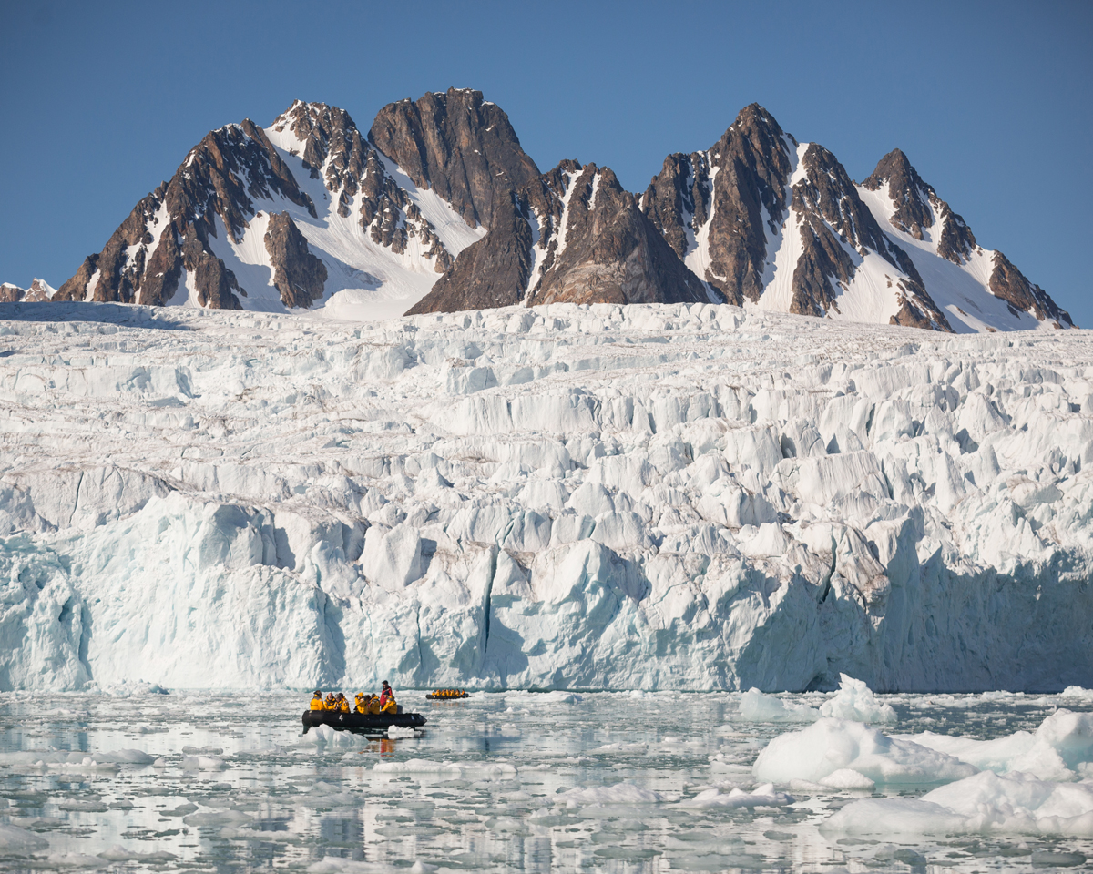 Quark passengers zodiac cruising in Spitsbergen.