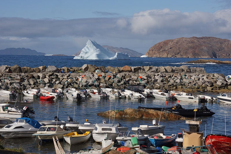 You might see colorful fishing boats in the small town of Upernavik on your Arctic expedition in Greenland.