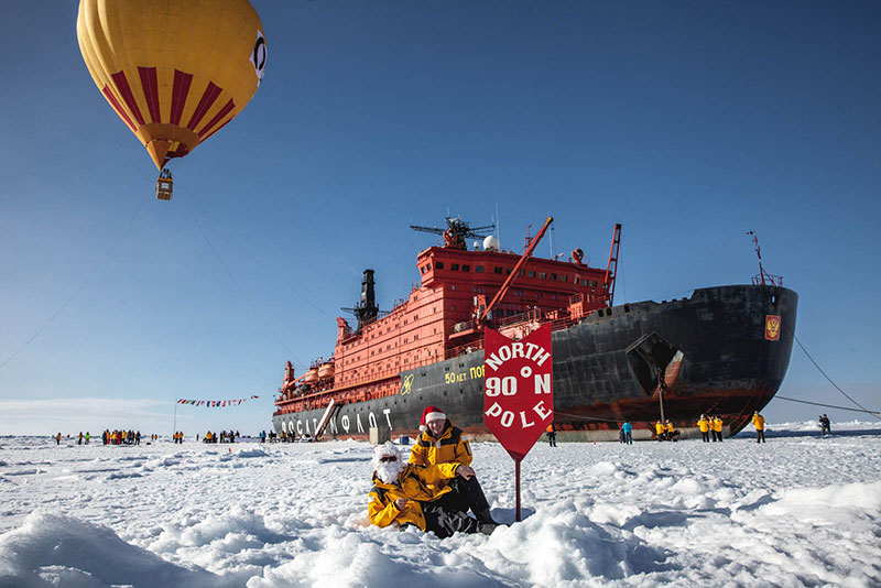 A hot air balloon sails high overhead the icebreaker 50 years of Victory at the North Pole. Photo credit: Samantha Crimmin