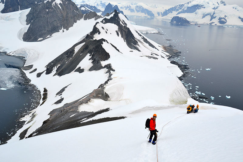 Mountaineering, hiking, Zodiac cruising and other adventurous activities make for physically and mentally rewarding vacations in the polar regions. Photo: Carlo Bellini
