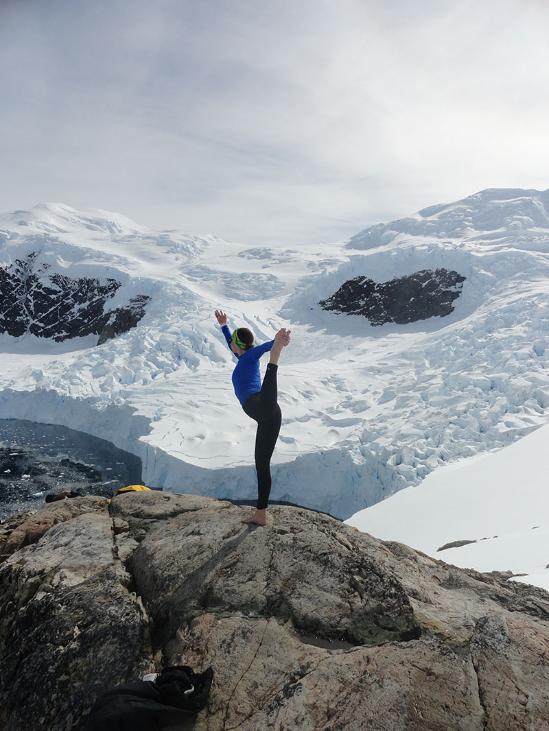 Yoga guide Sarah Hrdlicka takes a yoga break while hiking on the Antarctic Peninsula. Photo: Sarah Hrdlicka