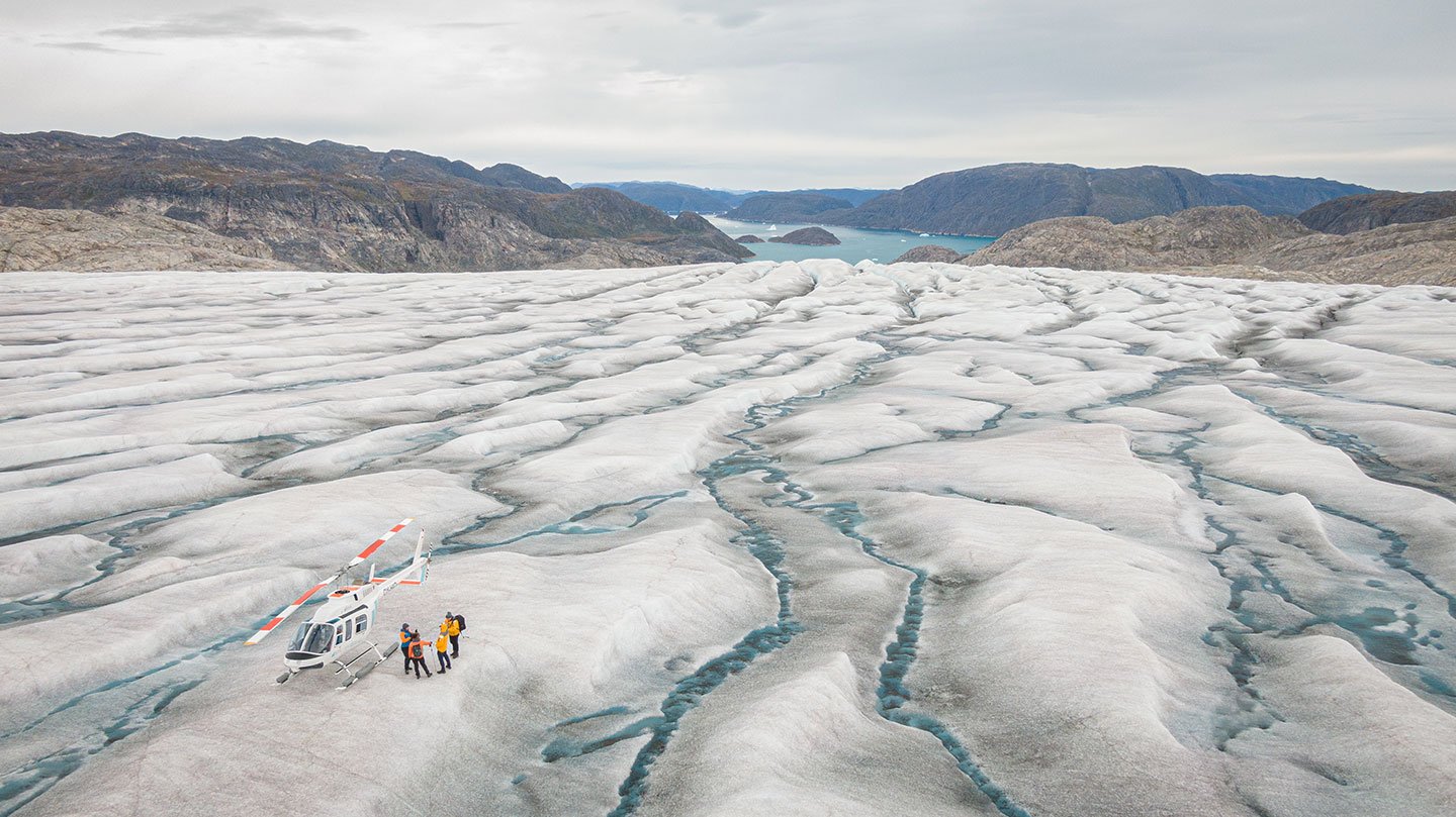 Quark Expeditions takes guests by helicopter to the Greenland Ice Sheet where they can set foot and walk on the second-largest ice mass on the planet.
