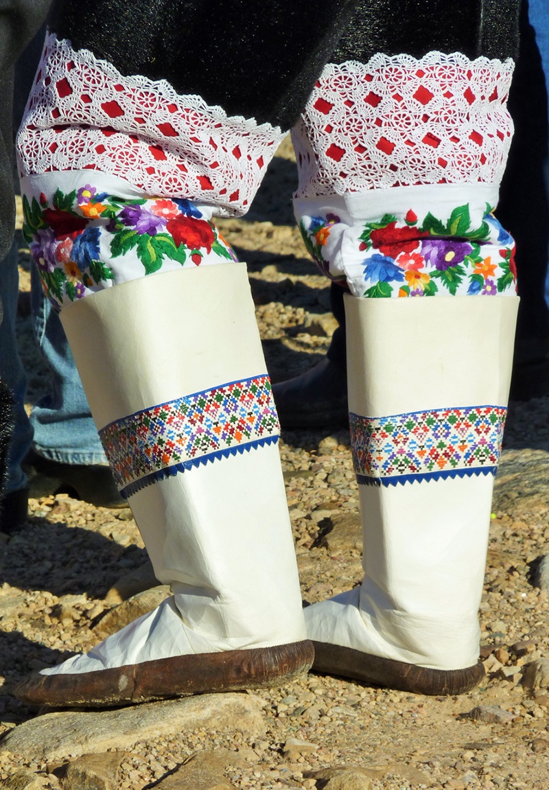 A woman wears traditional Thule boots in an Arctic community.