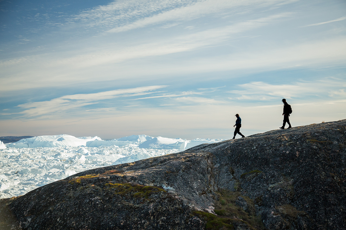 Passengers pictured hiking near Ilulissat Icefjord, in Greenland. Photo by Acacia Johnson
