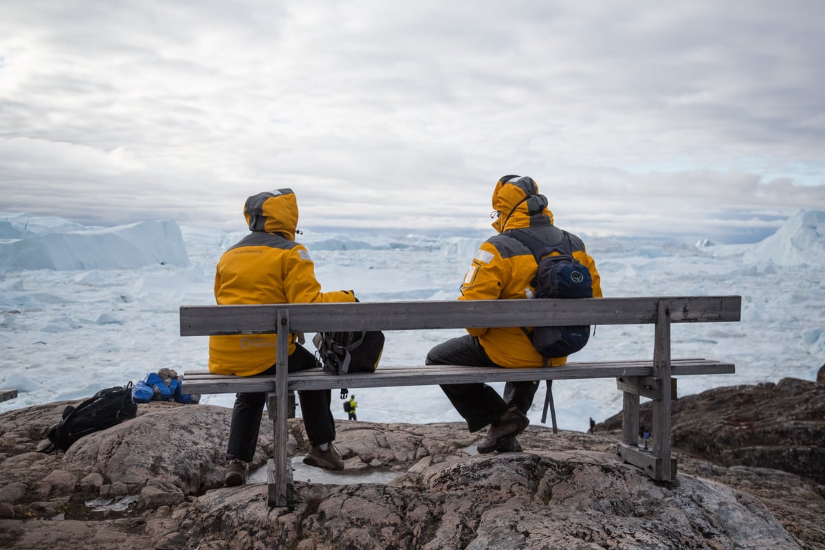 Quark Expeditions Passengers take a break while exploring the Ilulissat icefjord, in Greenland