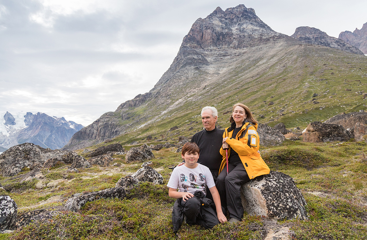 Guests hike along Lindenow Fjord, Greenland.