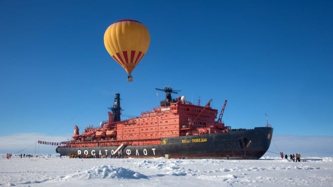 Soar high over the sea ice in a hot air balloon, one of the adventures available on a North Pole expedition.