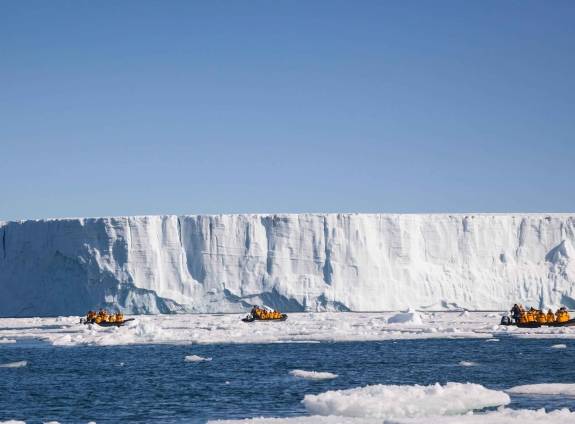 Zodiacs cruising through the Antarctic