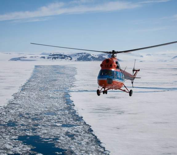 Helicopter in Arctic landscape