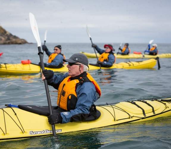 Passengers kayaking near the Norwegian Coast