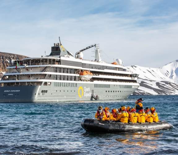 Guests in a zodiac cruise ready to explore Deception Island, Antarctica. 