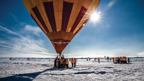 Passengers getting on hot air balloon