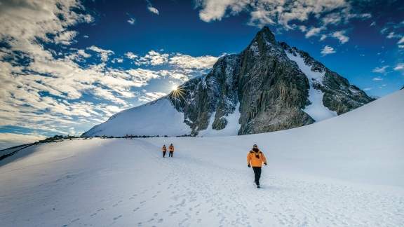 Passengers hiking in Antarctic Landscape